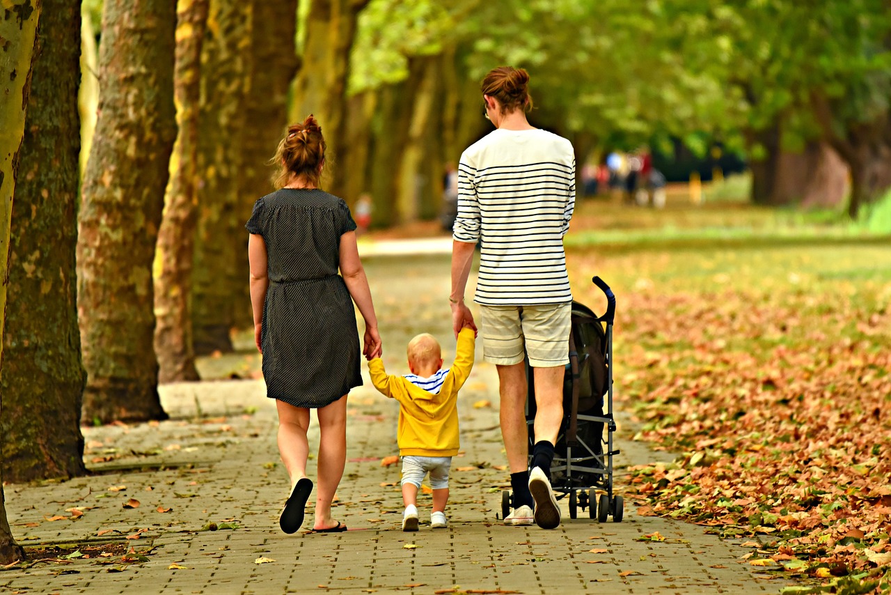 A family taking a stroll in the park.